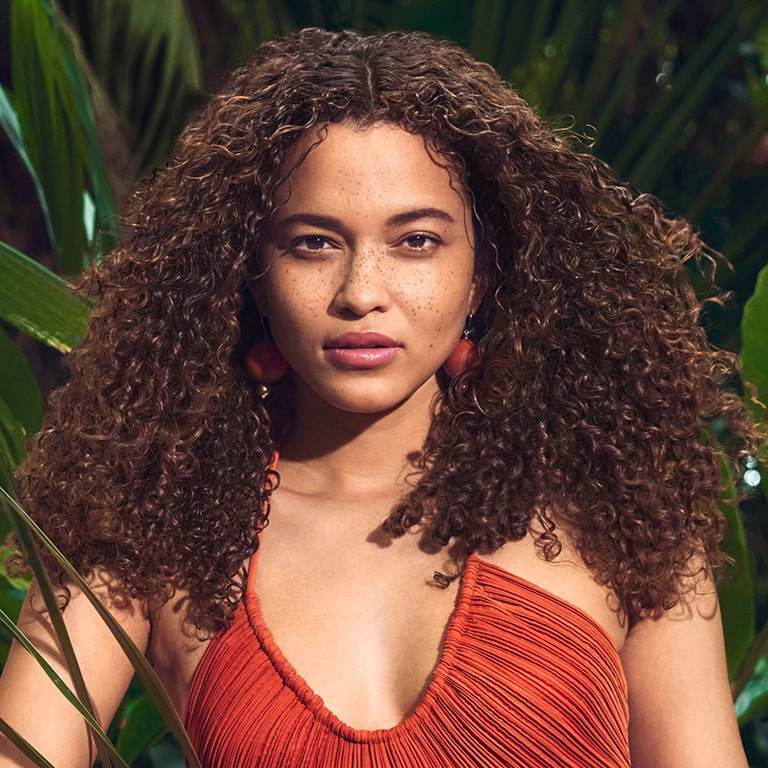 woman in red dress with curly-hair